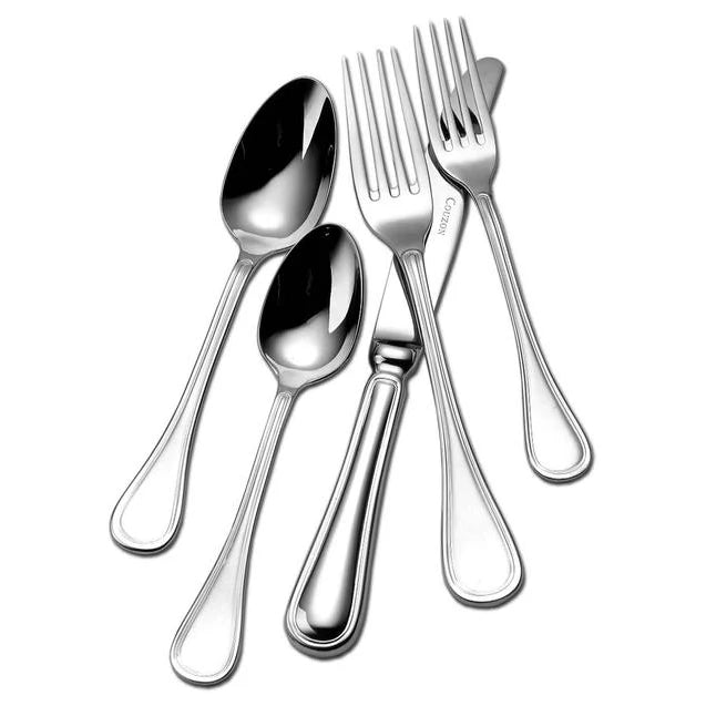 Five pieces of Couzon "Lyrique" stainless flatware—including two forks, two spoons, and one knife—are neatly arranged with overlapping handles on a white background.