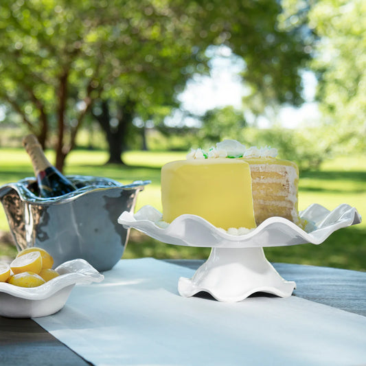 Beatriz Ball VIDA Havana white pedestal cake plate styled outdoors holding cake and citrus