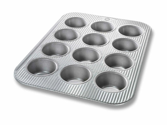 USA Pan 12-cup muffin pan with gray nonstick finish and ribbed exterior