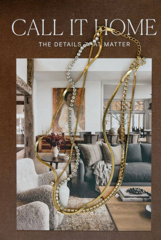 Chansut Pearls Leah necklace styled over home interior backdrop with gold and crystal chains