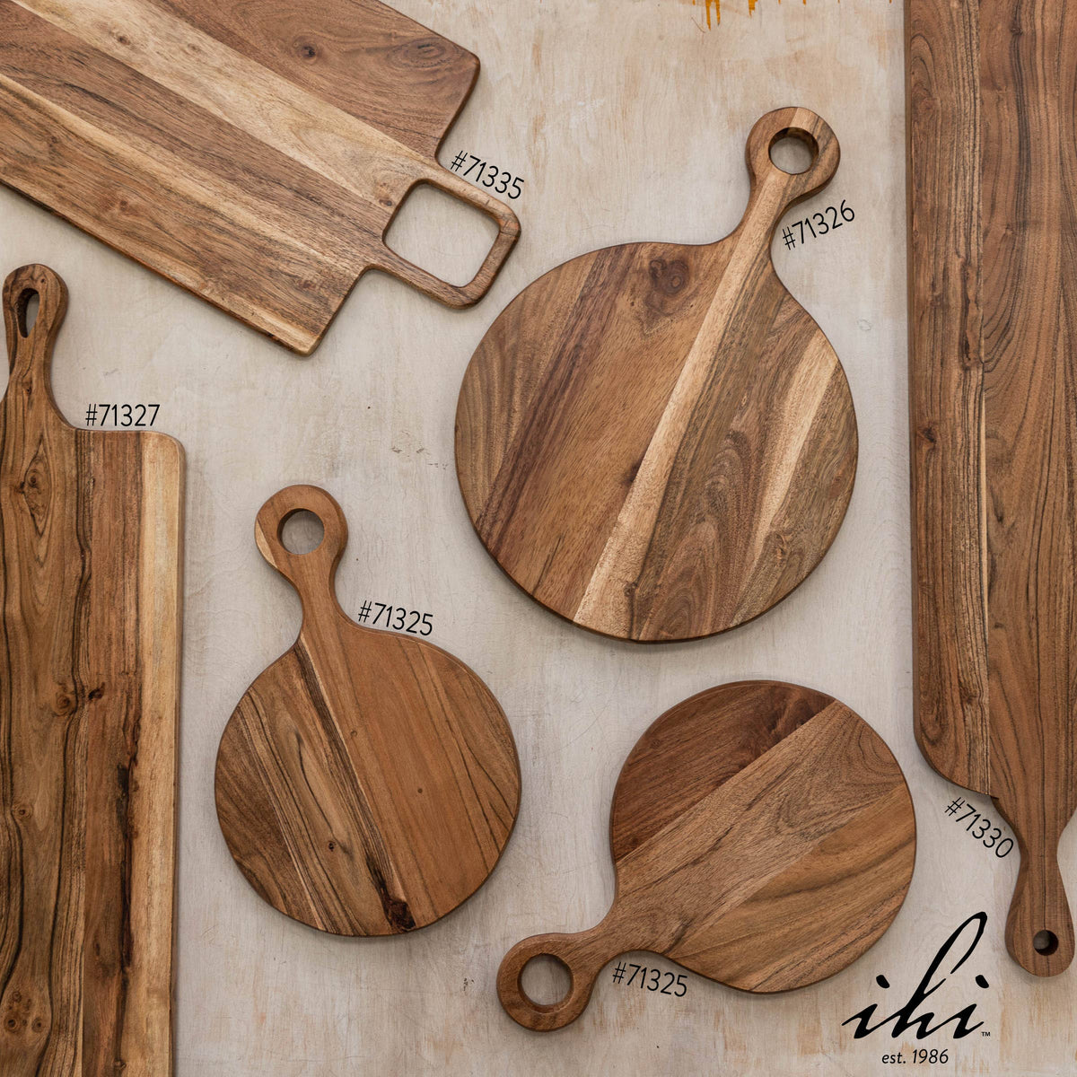 Assorted India Handicrafts Inc wooden serving and cutting boards including round and rectangular shapes