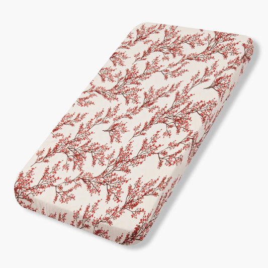 Milkbarn fitted crib sheet with red berry branch botanical print on natural cotton