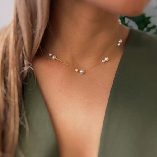Woman wearing Ellison+Young Lovely Lady Dainty Pearl Necklace with rose gold chain