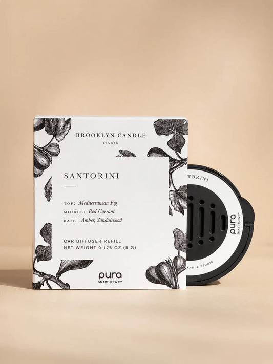 Brooklyn Candle Studio Santorini car diffuser refill with white botanical-printed box and black Pura device