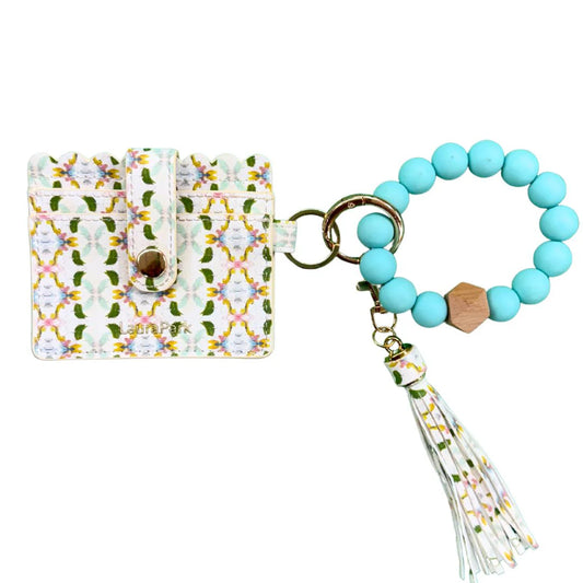 Laura Park Designs keychain wristlet with turquoise bead bracelet, cream floral fabric card holder, tassel charm