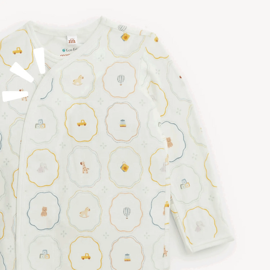 The Magnetic Me Nursery Magic Magnetic Gown & Hat Set by Magnetic Me is crafted from soft TENCEL™ modal and features a charming pastel animal and vehicle pattern on a white background, with convenient magnetic closures for easy changing.
