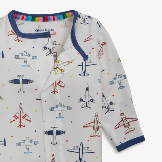Magnetic Me Just Plane Fun footie neckline detail with rainbow trim and colorful airplane print on cream