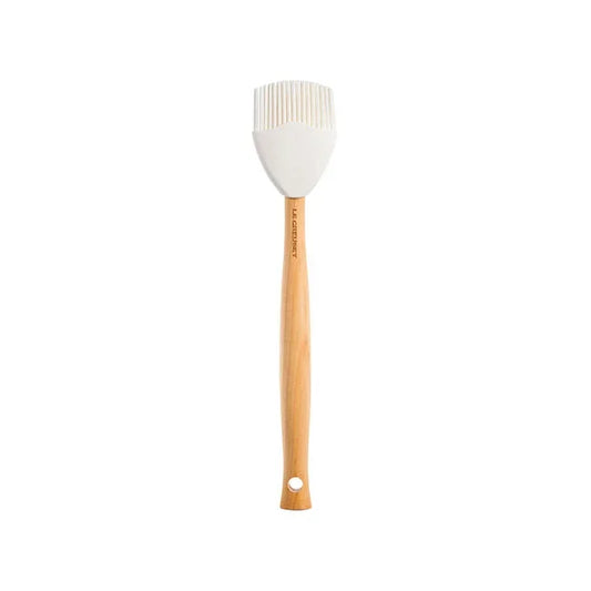 Le Creuset Craft Series basting brush with white bristles and natural wood handle