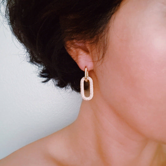 Ellison+Young Urban Glow Link Drop Earrings worn on ear, gold and crystal links in motion