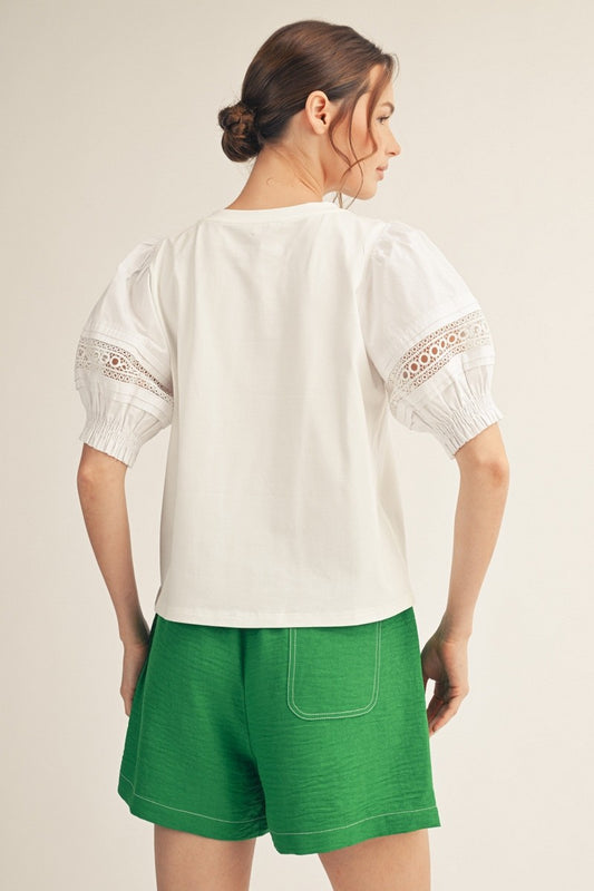 Jodifl Lace Accent Puff Sleeve Top in cream, back view, with lace-trimmed puffed sleeves and gathered cuffs