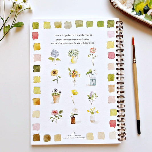 Interior spread of Emily Lex Studio workbook showing twelve flower sketches and watercolor painting instructions
