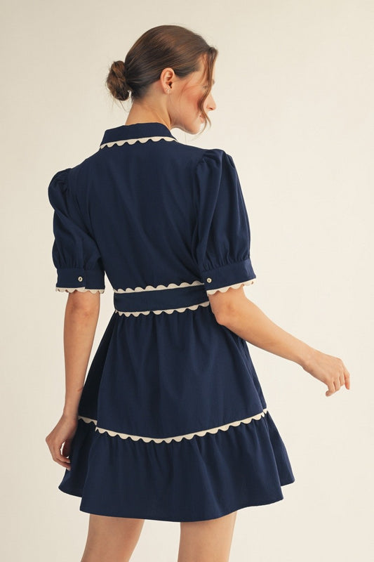 Jodifl Navy Scallop Trim Button Down Babydoll Dress back view showing puffed sleeves and tiered skirt