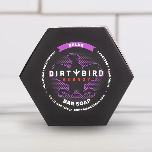 Dirty Bird Relax bar soap in black hexagonal packaging with purple bird logo and 'Relax' banner