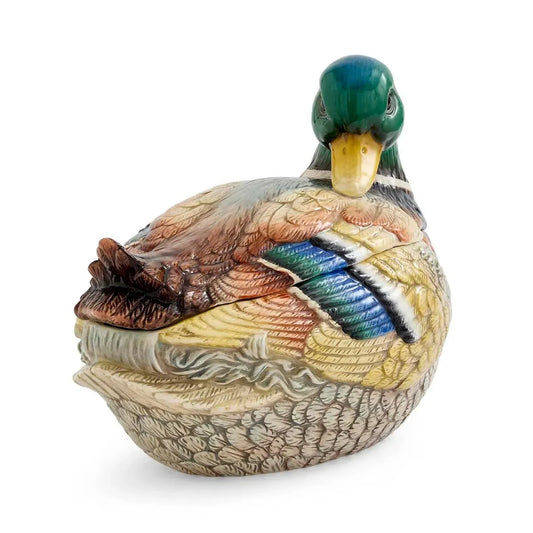 The Spode Woodland Mallard Lidded Server by Spode is a ceramic serving dish shaped and hand-painted like a mallard duck, featuring detailed feathers in green, blue, brown, and tan hues with an upright head and folded wings—a charming decorative piece for any table.