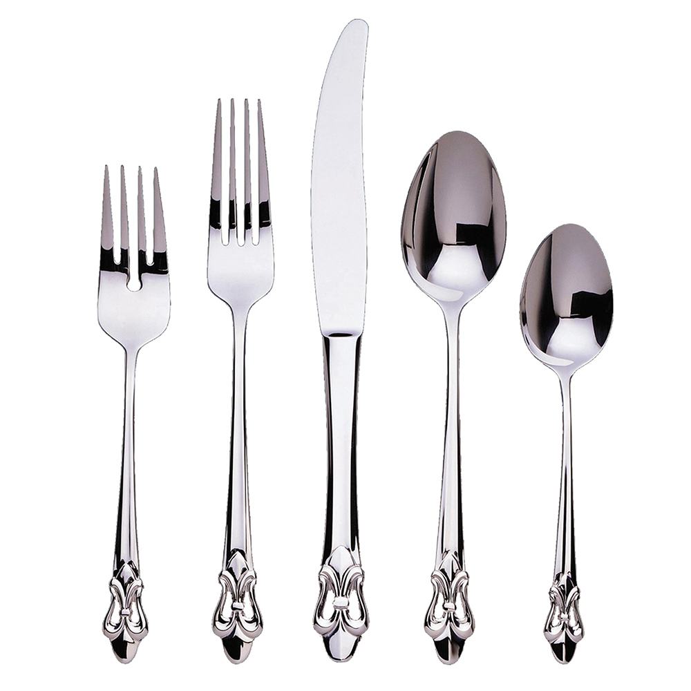 Five pieces of Ginkgo "Fleur De Lis" Stainless Flatware by Gingko—salad fork, dinner fork, knife, soup spoon, and teaspoon—each featuring ornate, decorative handles with a fleur-de-lis motif, are arranged side by side on a plain white background.