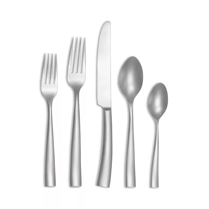 Five pieces of Couzon "Silhouette - Velvet" stainless flatware by Couzon—two forks, one knife, one soup spoon, and one teaspoon—are arranged side by side on a white background, each featuring simple, modern handles.