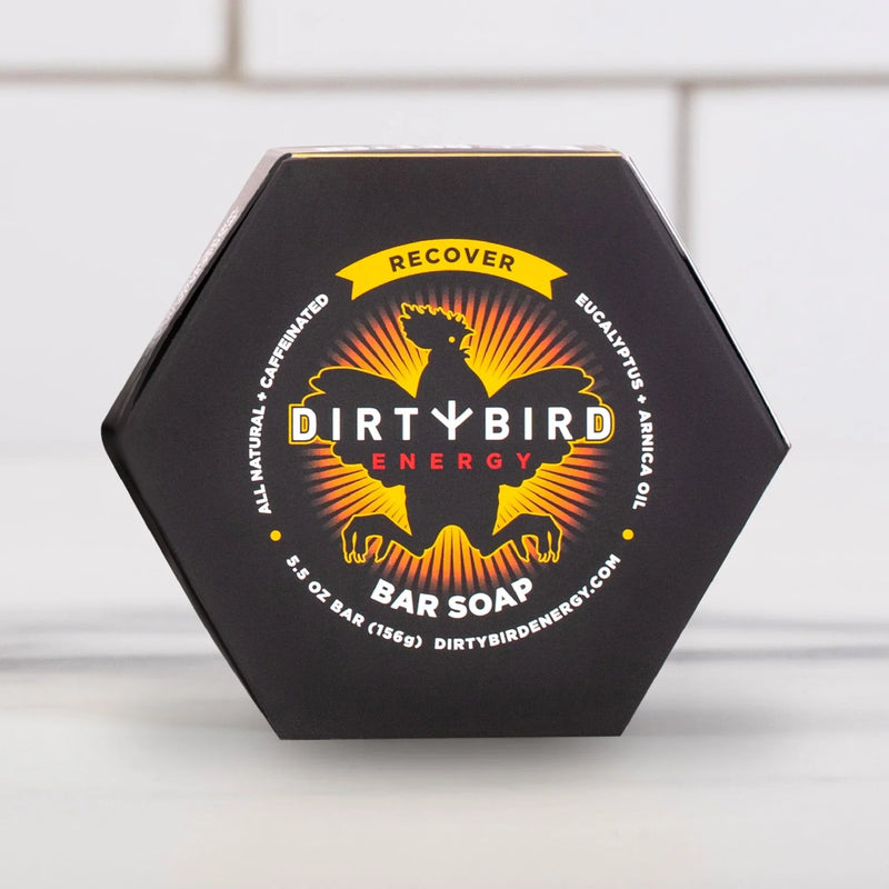 Dirty Bird Energy bar soap in black hexagonal packaging with yellow and orange bird logo and 'Recover' banner