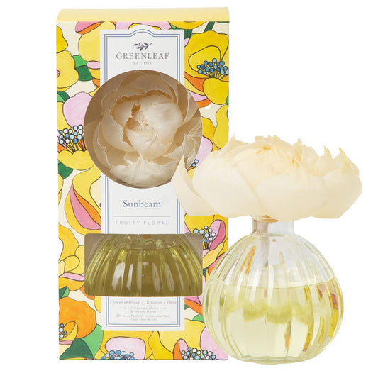 Greenleaf Gifts Sunbeam Flower Diffuser set with colorful yellow-pink floral box, tan peony-shaped ceramic diffuser, and two glass bottles with green