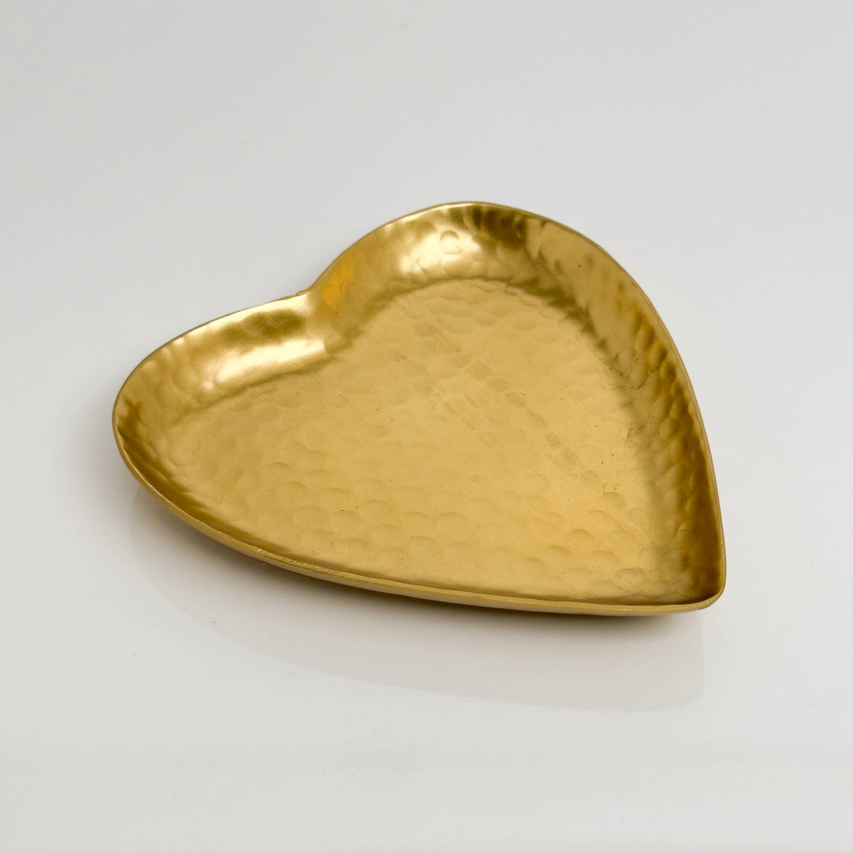 India Handicrafts Inc hammered aluminum heart-shaped decorative tray in gold, angled top view