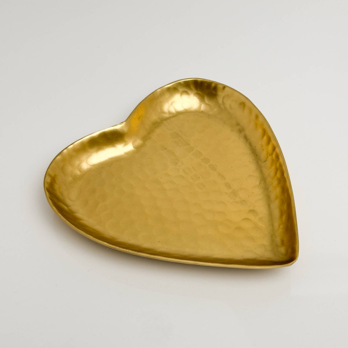 Gold heart-shaped tray angled perspective showing depth