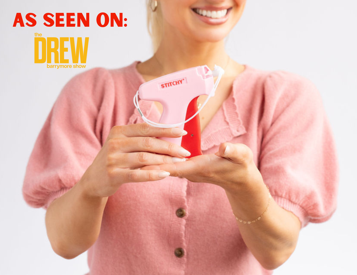 Tucky Stitchy portable pink sewing machine being held by woman in pink top, as seen on Drew
