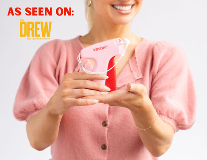 Tucky Stitchy portable pink sewing machine being held by woman in pink top, as seen on Drew