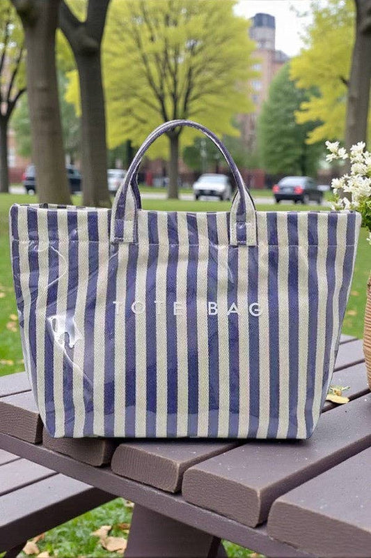 Nash Grey blue and beige striped canvas tote bag with handles, outdoor setting