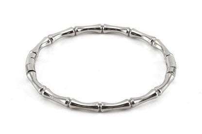 Mio Queena - Multi-style 18K Gold-plated Stainless Steel Bangle, featuring segmented, bamboo-inspired tube-like sections, is beautifully displayed on a white background—a striking bracelet from Mio Queena, ideal for jewelry gifts.
