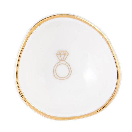 Cream ceramic ring dish with gold trim and diamond ring illustration, top view