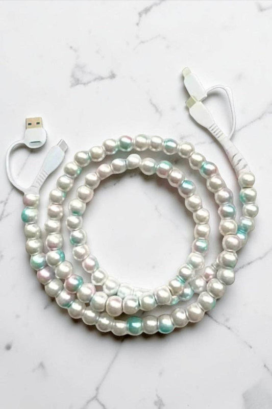 Nash Grey Tie-Dye Beaded Cord Charger with pearl and mint green beads, white USB cable coiled on marble surface