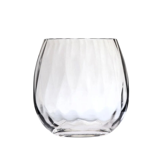 The Skyros Designs "Abigail" Stemless Wine Glass features a clear, empty form with a rounded, slightly tapered silhouette and a textured, wavy pattern on its surface, displayed against a plain white background.