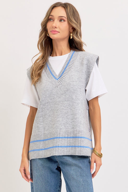 Sweet Lovely by Jen Effortlessly Essential Knit Vest in light gray with blue V-neck and striped trim, worn over white tee and jeans, front view
