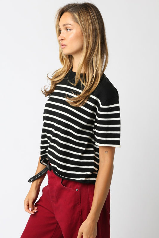 Olivaceous Nicole stripe knit top in black and white, three-quarter profile view