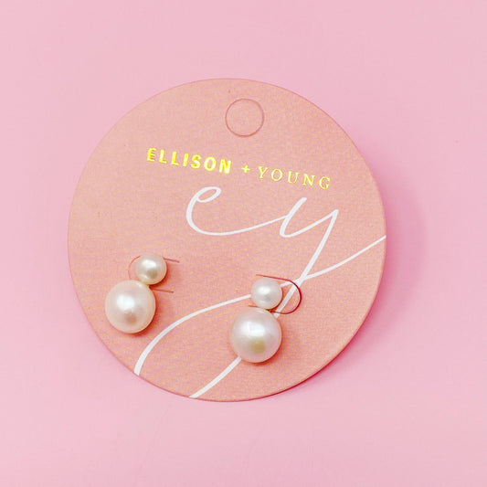 Ellison+Young Classic Double Pearl Earrings on circular pink branded card displaying paired white pearl studs