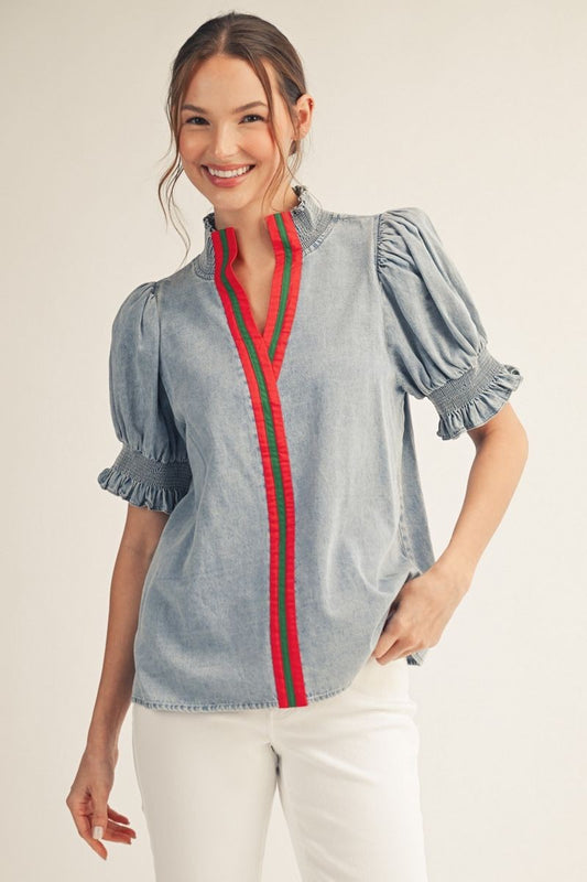 Jodifl light-washed denim top with puffed sleeves, ruffled cuffs, and red striped V-neck trim