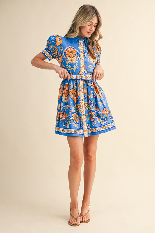 &Merci Floral Paisley Button Down Belted Mini Dress in blue with orange paisley print, side view with belt detail