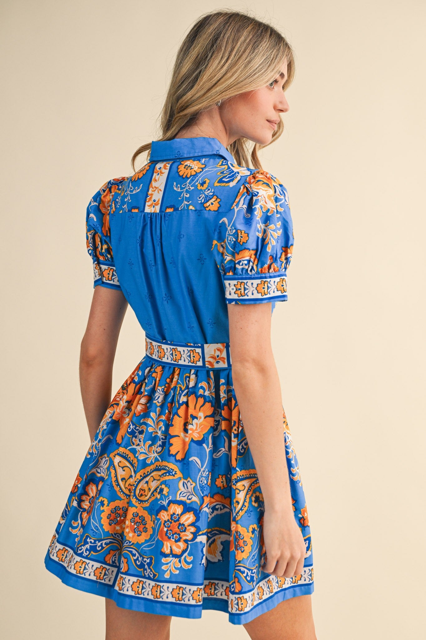 &Merci floral paisley button-down belted mini dress in blue and orange, back view