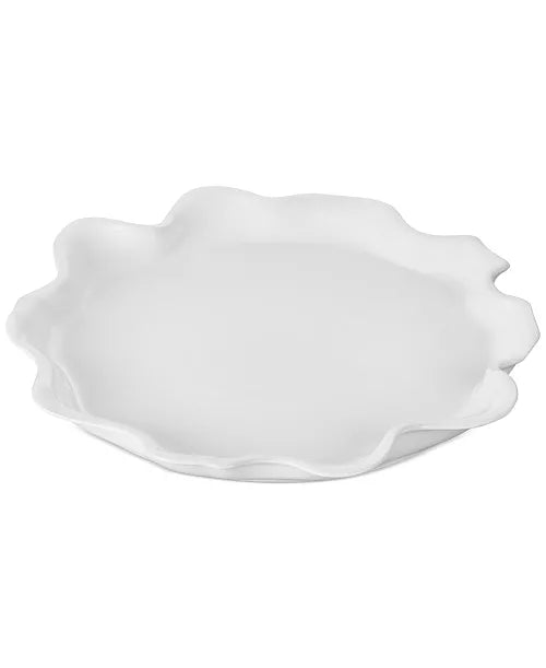 Le Creuset Iris Collection white serving platter with scalloped petal-shaped edge