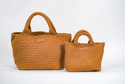 Two Parker & Hyde Classic Woven Tote bags in camel, each a different size, both featuring short handles and displayed side by side against a plain white background.