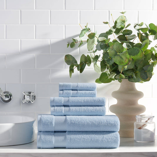 Arkwright Home Host & Home 6-piece bath towel set in light blue stacked on bathroom vanity