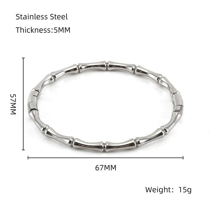 The Mio Queena Multi-style 18K Gold-plated Stainless Steel Bangle – FGS features a unique bamboo-inspired design in silver stainless steel, measuring 5mm in thickness with an inner diameter of 67mm, outer width of 75mm, and weighing 15g. Presented against a white background with labeled measurements, this stylish bangle by Mio Queena is an ideal jewelry gift for any occasion.