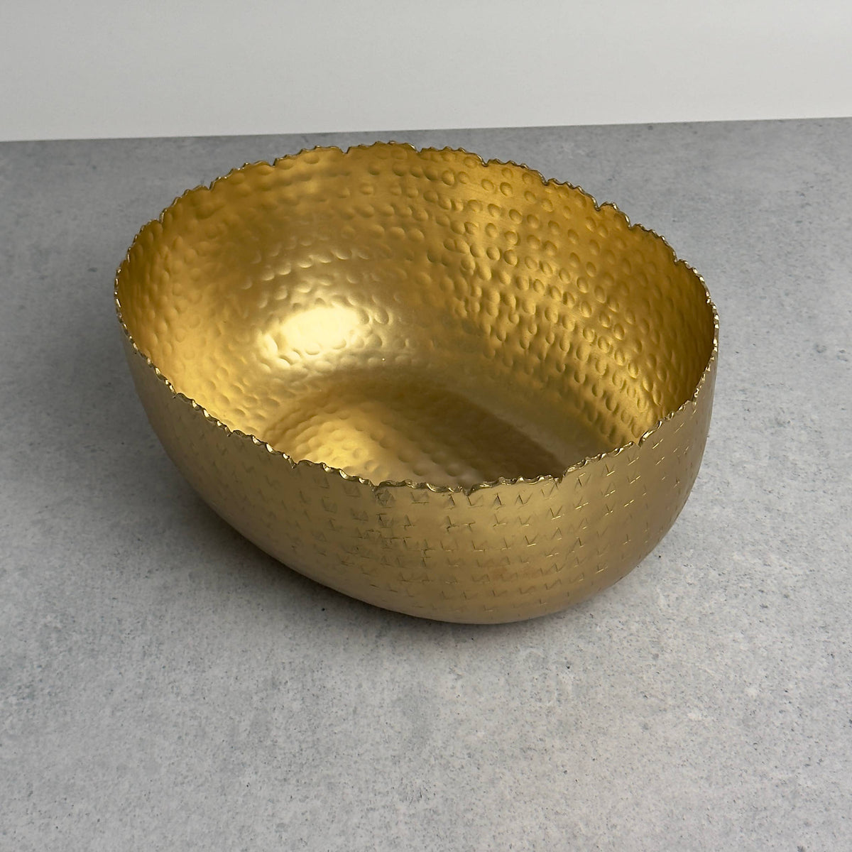 Gold hammered bowl overhead angle displaying interior depth and hammered pattern