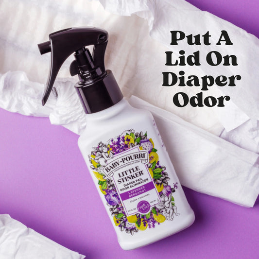 Baby Pourri Little Stinker Lavender Bergamot spray bottle on purple background with diapers and text overlay