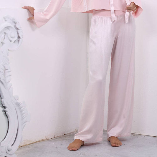 PJ Harlow Lola pale pink wide-leg pajama pants styled with matching shirt, full length side view