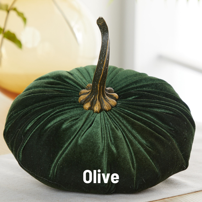 A luxurious, extra large velvet pumpkin-shaped accent in deep olive green from Your Heart’s Content, featuring a realistic stem and beautifully displayed on a table. Ideal as a wedding centerpiece or holiday mantel décor, this thoughtful gift adds a touch of elegance and warmth to any setting.