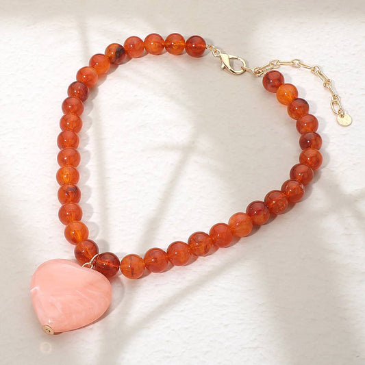 Sensibling Corp. chunky marbled pink resin heart charm beaded necklace with coral faceted beads and gold clasp