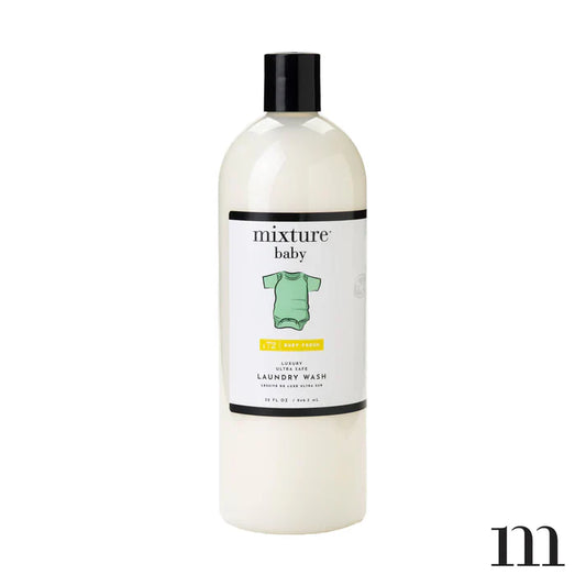 Mixture Baby Laundry Wash in cream bottle with black cap and label featuring green onesie graphic