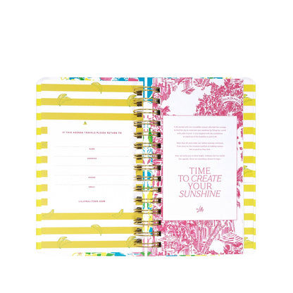 Organize your 2026-2027 schedule in style with the Lilly Pulitzer by Lifeguard Press - Medium 17 Month Agenda, Lovely Lilly. Open to reveal yellow striped pages on the left for your personal information and a right page decorated with a stunning pink floral print and the inspirational phrase "Time to create your sunshine" in bold pink text—an eye-catching way to brighten every plan.