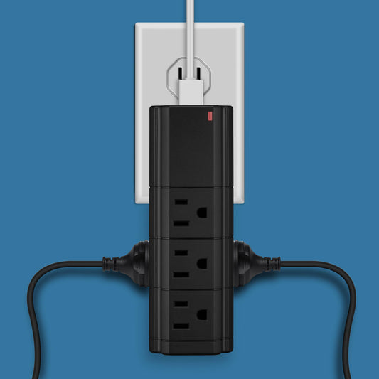 LAX Gadgets black charging tower surge protector plugged into white outlet with cord