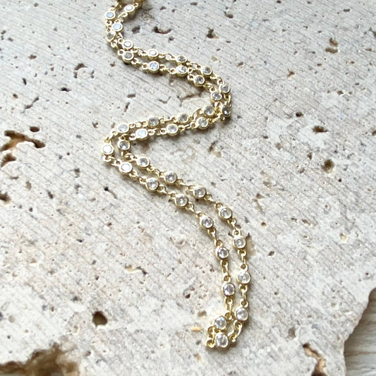VB&CO Designs gold crystal layering necklace draped showing sparkly chain detail